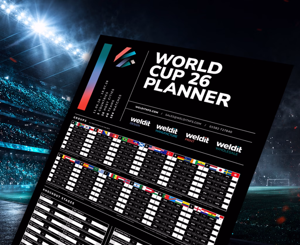 Promotional banner for a free World Cup 2026 planner showing a printable tournament wall planner against a floodlit football stadium backdrop with dramatic lighting and atmospheric effects.